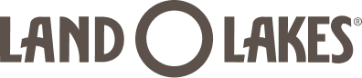 Logo for Land O'Lakes with the text "LAND O LAKES" in bold, uppercase letters. The “O” in the center is larger than the other letters. The design is in a dark brown color on a light background.