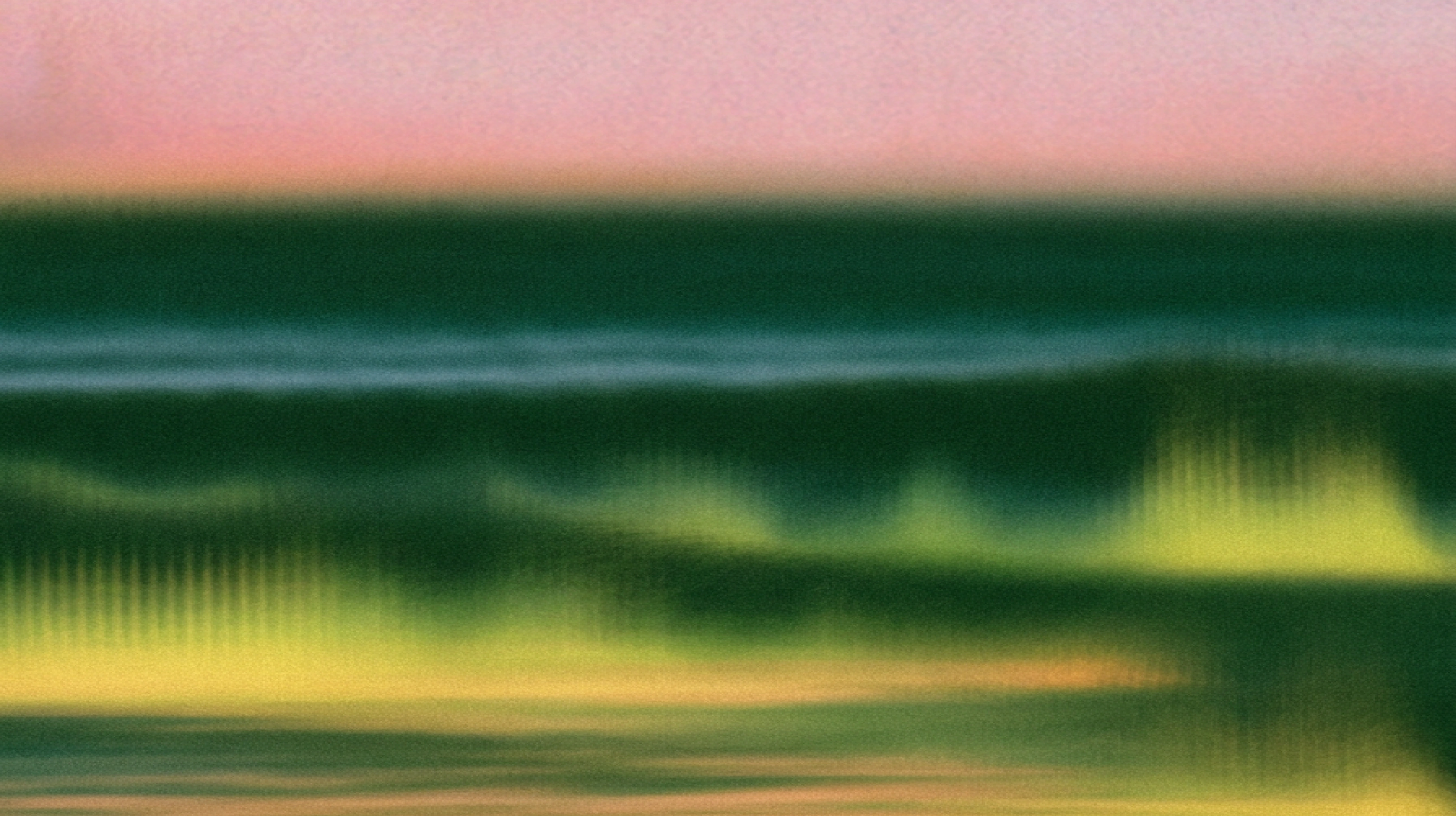Abstract image with horizontal green, yellow, and pink bands, evoking the feel of a blurry landscape or seascape at sunset, with a soft, hazy, and gradient effect throughout.