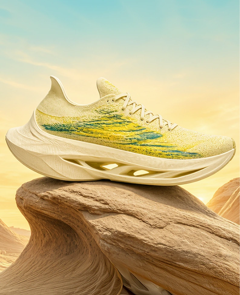 Yellow and blue athletic sneaker with a chunky sole displayed on a rock, set against a desert landscape with a bright, clear sky.